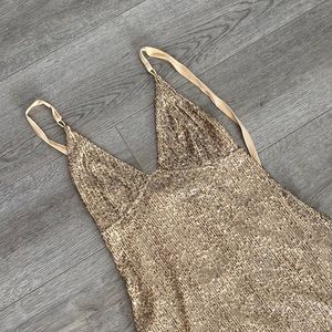 free people gold sparkle mini dress with tied back. size small.